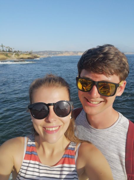 I&B's Founder & Husband with the sea and sunset cliffs in the background