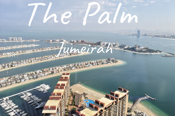 Aerial view of The Palm Jumeirah, showcasing luxury islands and the coastline.