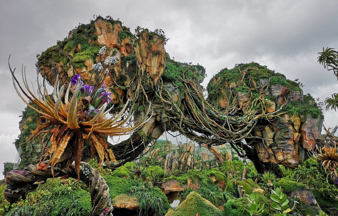Lush, fantastical landscape with uniquely shaped greenery and vibrant flora.