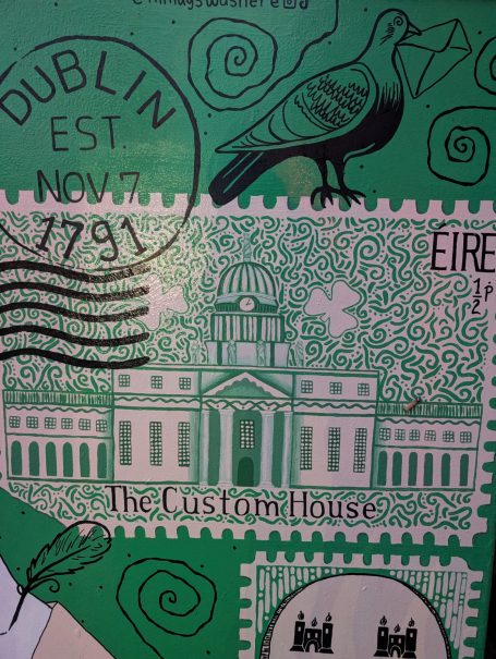 Design featuring Dublin's Custom House with a green background and a pigeon illustration.
