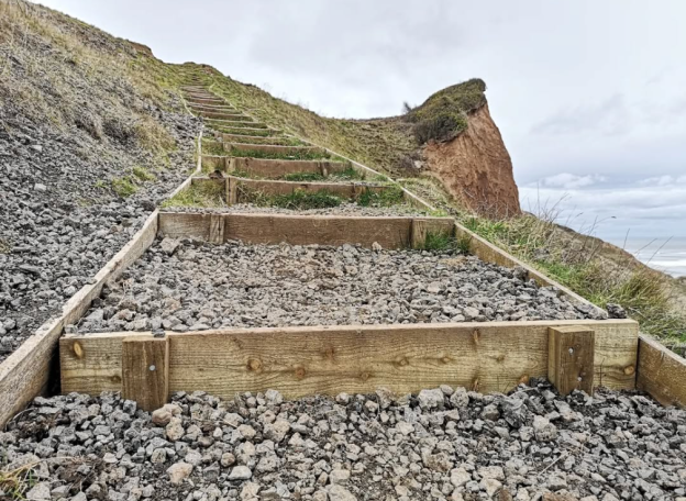 Wooden steps up a hill face, leading from Skinningrove Beach to the Cleveland Way