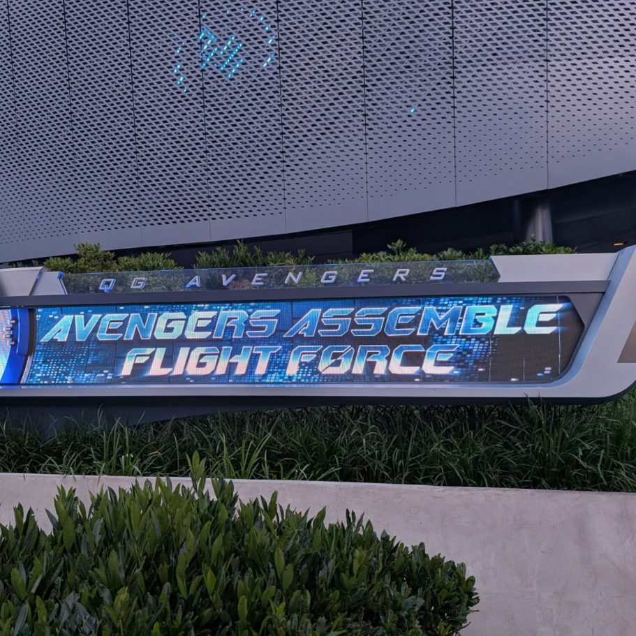 Sign for "Avengers Assemble: Flight Force" at a futuristic-themed location.