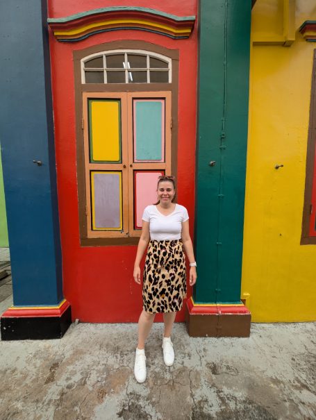 I&B's Founder posing with the colourful Former House of Tan Teng Niah in Singapore.