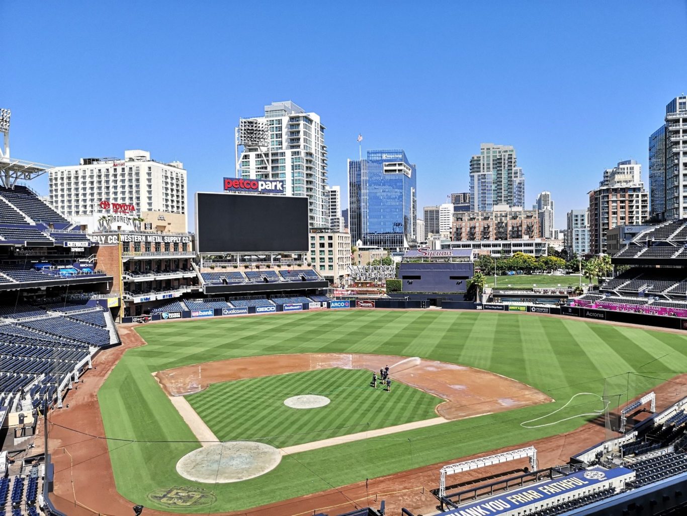 Petco Park baseball stadium with San Diego skyline of modern buildings in the background.