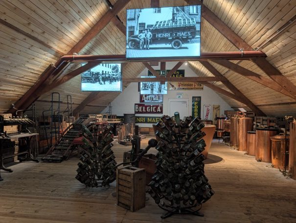 Interior of the De Halve Maan Brewery museum with vintage displays and wooden furnishings.