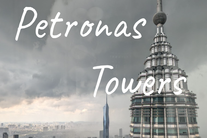 The Petronas Towers rise majestically against a stormy sky with the Merdeka 118 building in the background