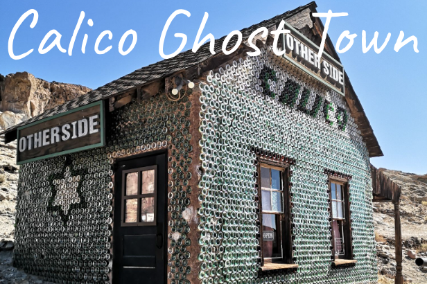Historic building in Calico Ghost Town, featuring a faded green exterior and wooden details.
