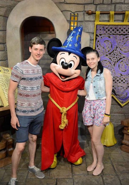 I&B's Founder & Husband posing with Mickey Mouse in his sorcerer outfit.
