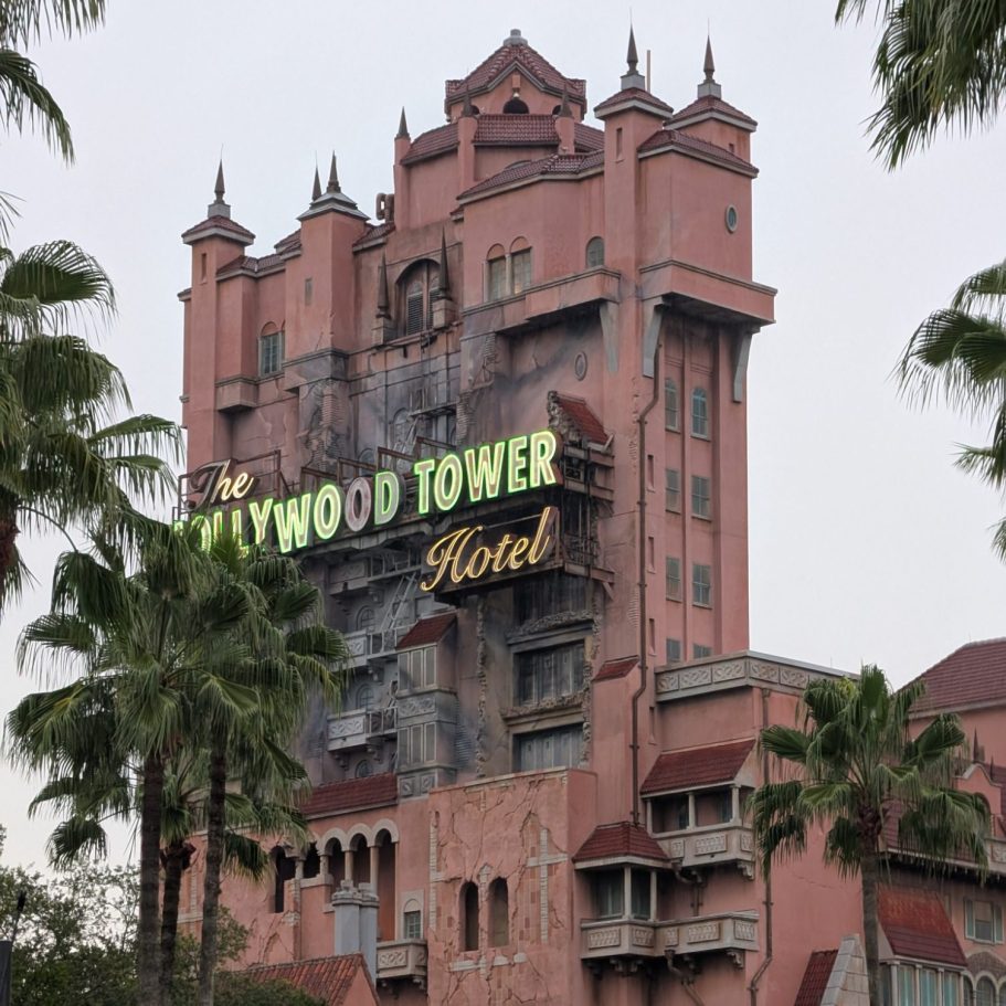 The Hollywood Tower Hotel, a tall, aged building with a spooky aesthetic and palm trees.