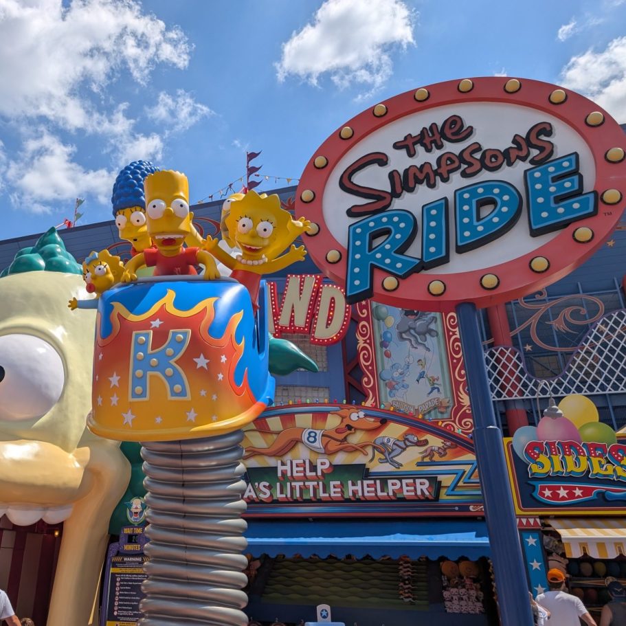 The Simpsons Ride entrance featuring characters and bright signage.