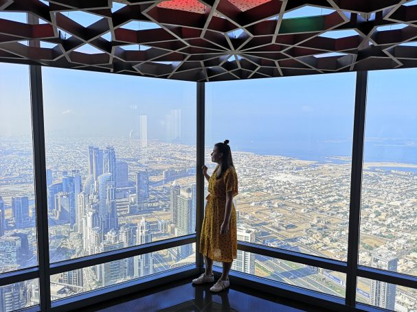 I&B's Founder posing at the top of the Burj Khalifa, with the Dubai skyline in the background.