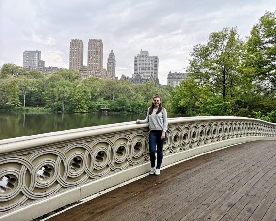 I&B's Founder posing on Bow Bridge in Central Park in New York City.