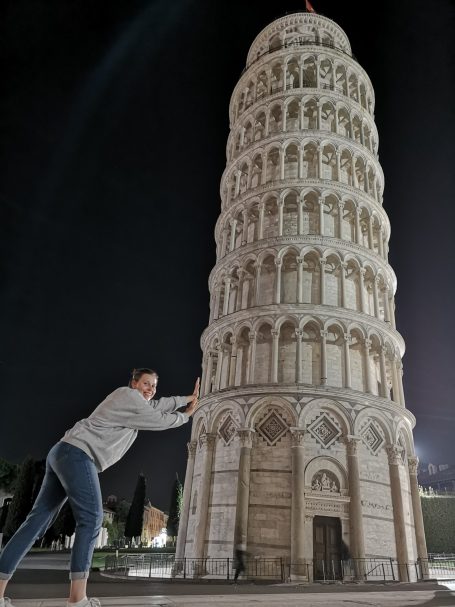 I&B's Founder pretending to hold up the Leaning Tower of Pisa at night.