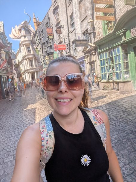 I&B's Founder posing in front of Diagon Alley at Universal Studios