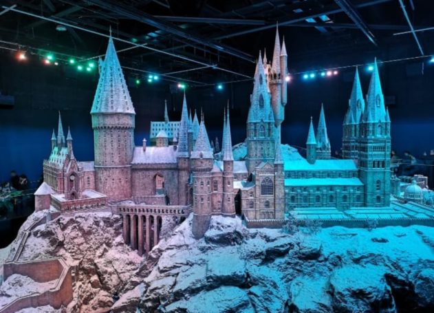 Snow-covered model of Hogwarts Castle, intricately detailed with towers and turrets.