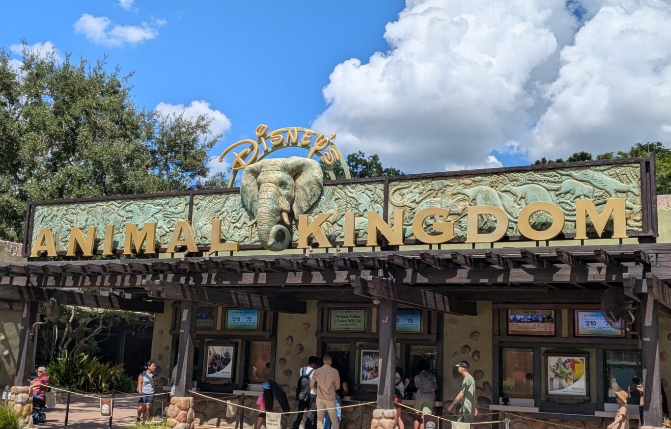 Sign for Disney's Animal Kingdom, featuring an elephant and themed decor.