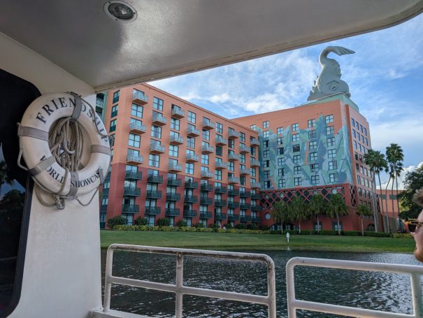 View of the Swan and Dolphin Hotel from a boat, featuring a lifebuoy in the foreground.