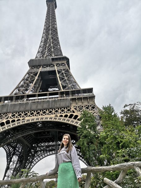I&B's Founder posing in front of the Eiffel Tower in Paris