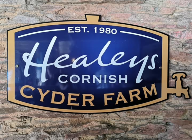 Blue and gold sign for Healeys Cornish Cyder Farm, established in 1980.