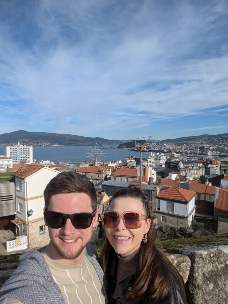 I&B's Founder & Husband posing with panoramic views of Vigo in the background.