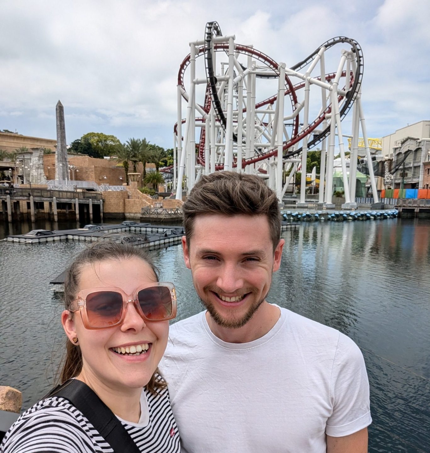 I&B's Founder & Husband posing in front of the Battlestar Galatica Rollercoaster