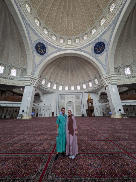I&B's Founder & Husband posing in traditional Muslim dress in the main prayer room at The Federal Territory Mosque in Kuala Lumpur.