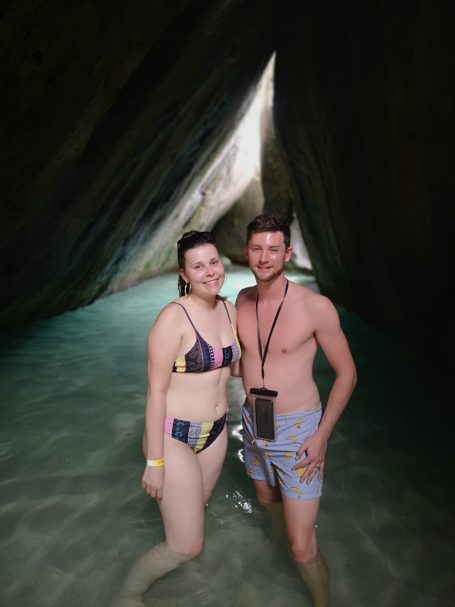 I&B's Founder & Husband posing in between rock formations, known as The Baths at Virgin Gorda.