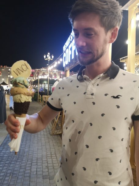 I&B's Founder's Husband posing at the Global Village in Dubai with a large ice cream