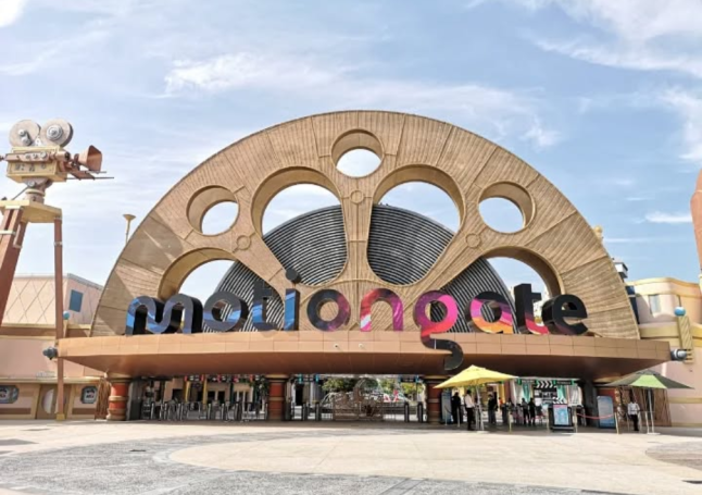 Entrance to Motiongate theme park in Dubai with a large, circular architectural feature.