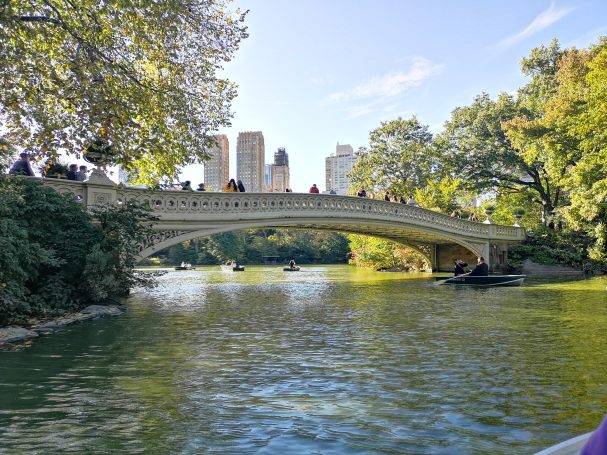 View of Bow Bridge in Central Park from a rowboat on The Lake.