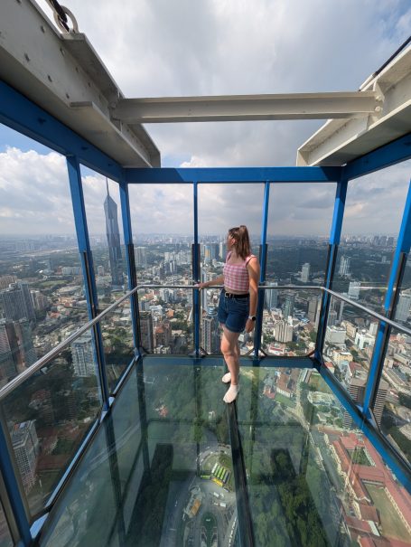 I&B's Founder looking out at the view of Kuala Lumpur from the glass Sky Box at the top of the KL Tower.
