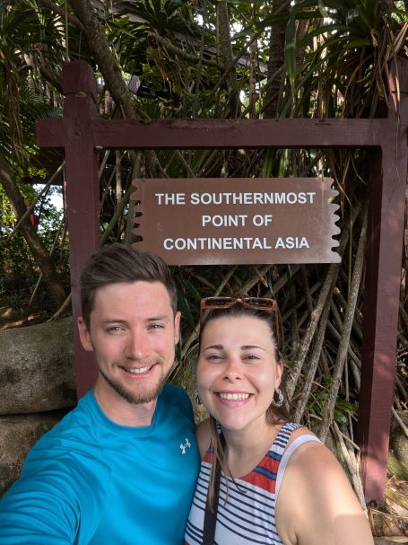 I&B's Founder and Husband posing in front of the Southernmost Point of Asia Sign on Palawan Island.