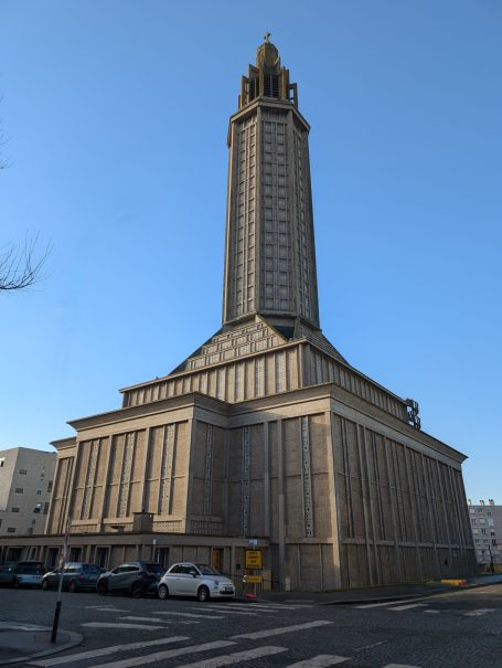 St Joseph's Church, a tall, modernist church tower with a distinctive shape against a clear blue sky.