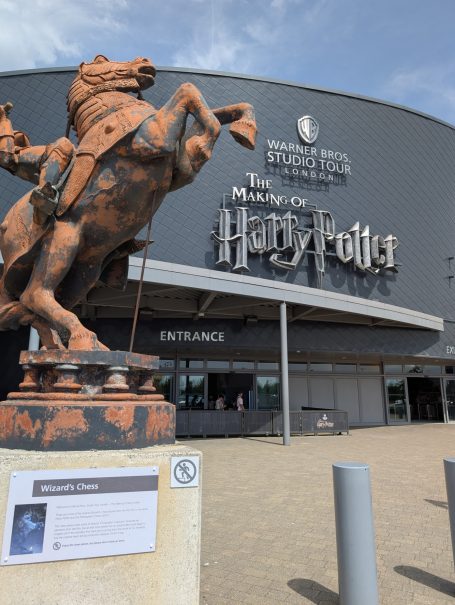 Bronze statue of a horse in front of the Harry Potter studio tour entrance in London.