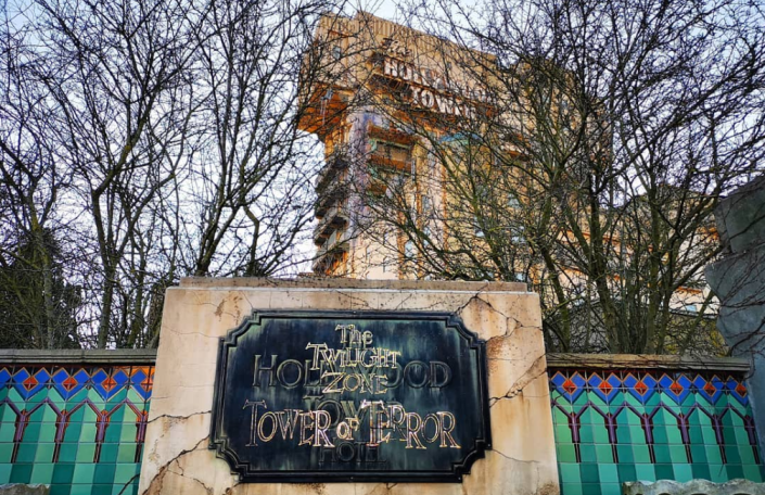 Sign reading "The Tower of Terror" with The Hollywood Tower Hotel building in the background. Tower of Terror ride @ Disneyland Resort Paris