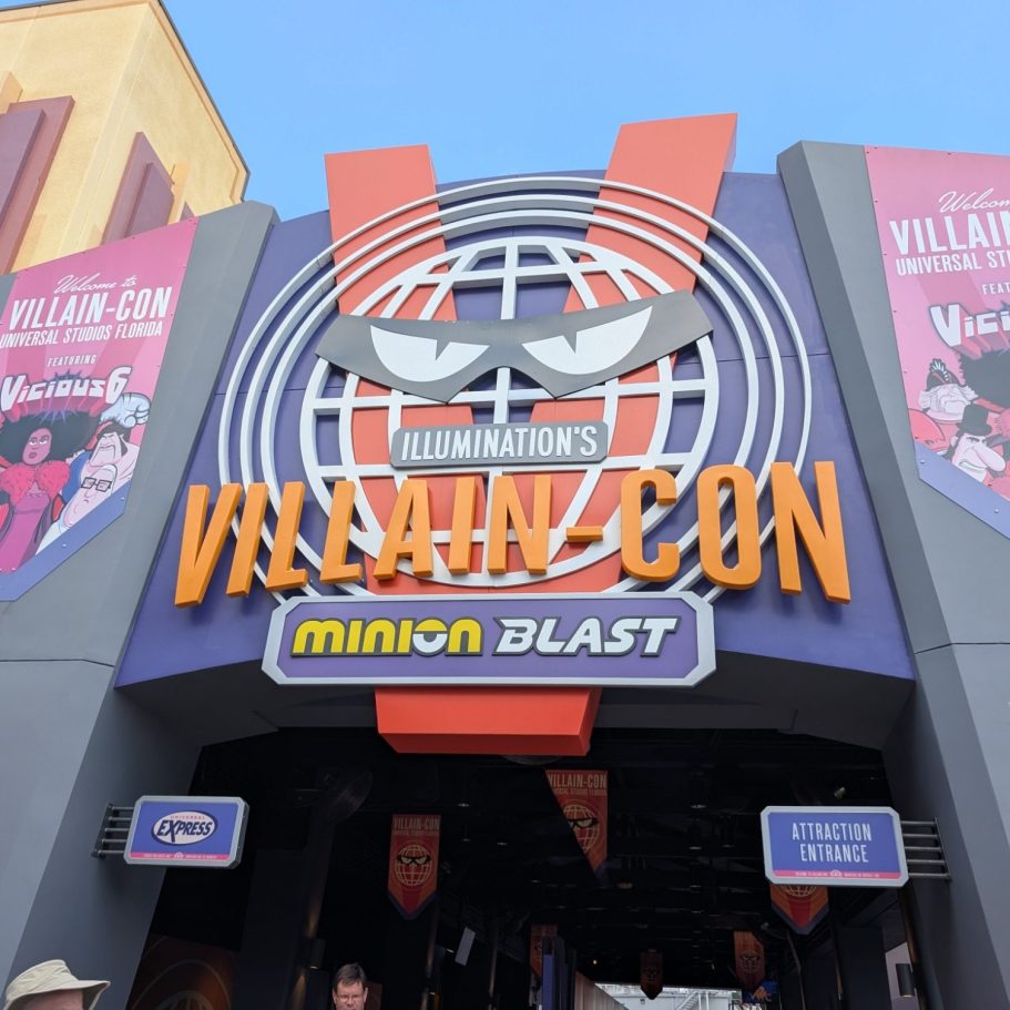 Entrance to Villain Con featuring a large sign and Minion-themed decorations.
