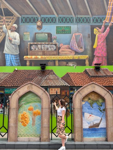 I&B's Founder posing in front of street art in the Little India area of Singapore.