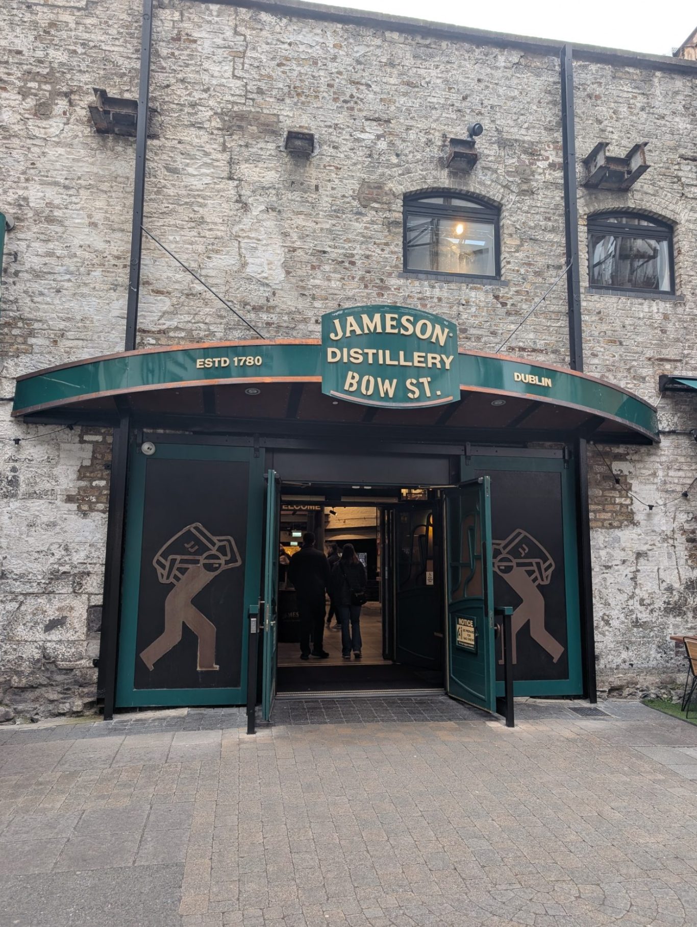 Entrance to the Jameson Distillery, featuring a stone building and large signage.