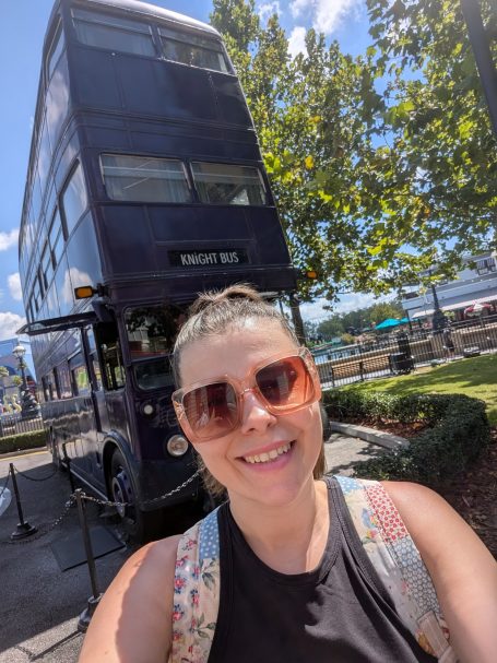 I&B's Founder posing in front of The Knight Bus from Harry Potter
