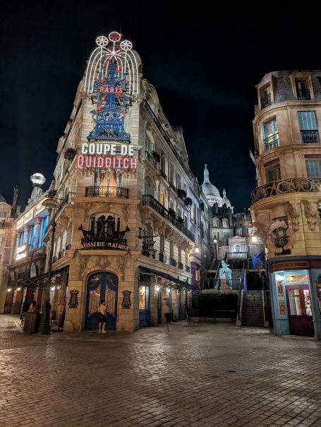 Historic buildings illuminated at night in a charming urban square.